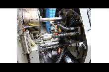 Прутковый токарный автомат продольного точения Tornos AS14 Stangenlademagazin фото на Industry-Pilot